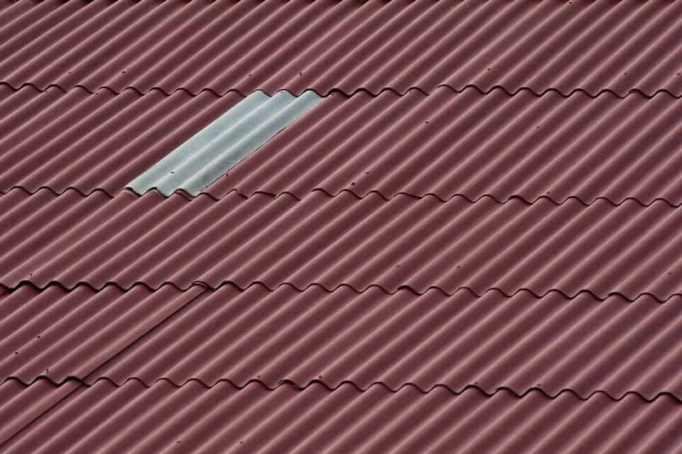 A commercial roof that has been damaged by weather and missing shingles near Nicholasville, Kentucky (KY)